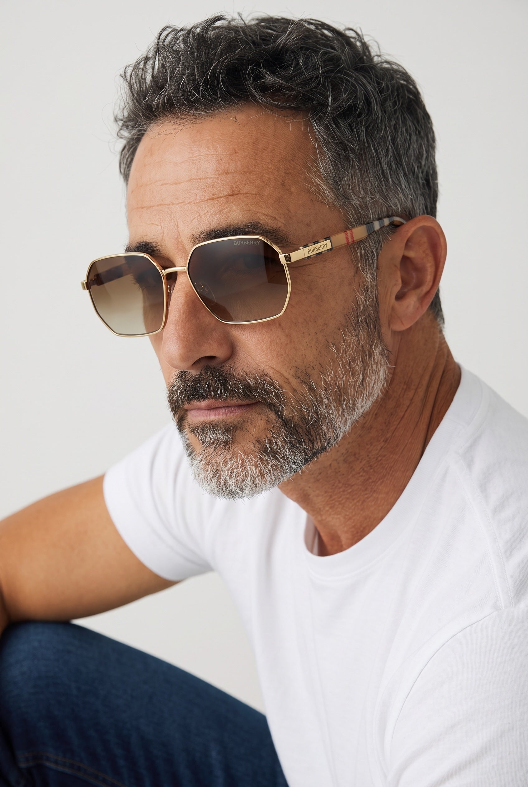 Burberry gold-tone sunglasses with brown gradient lenses on male model