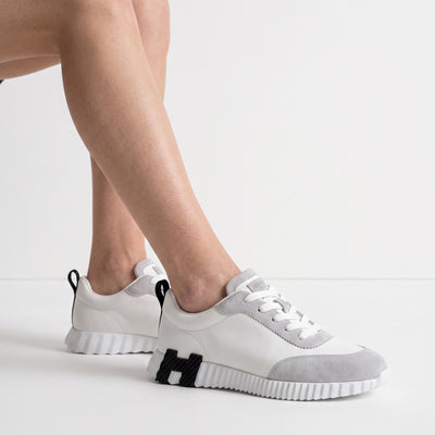 white and grey low-top chunky sneakers with ridged sole and suede-look panels