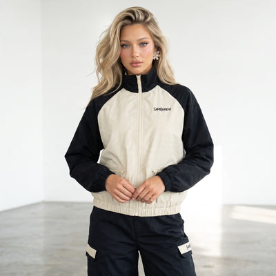 Saint Laurent beige and navy track jacket with cargo trousers laid flat and on model