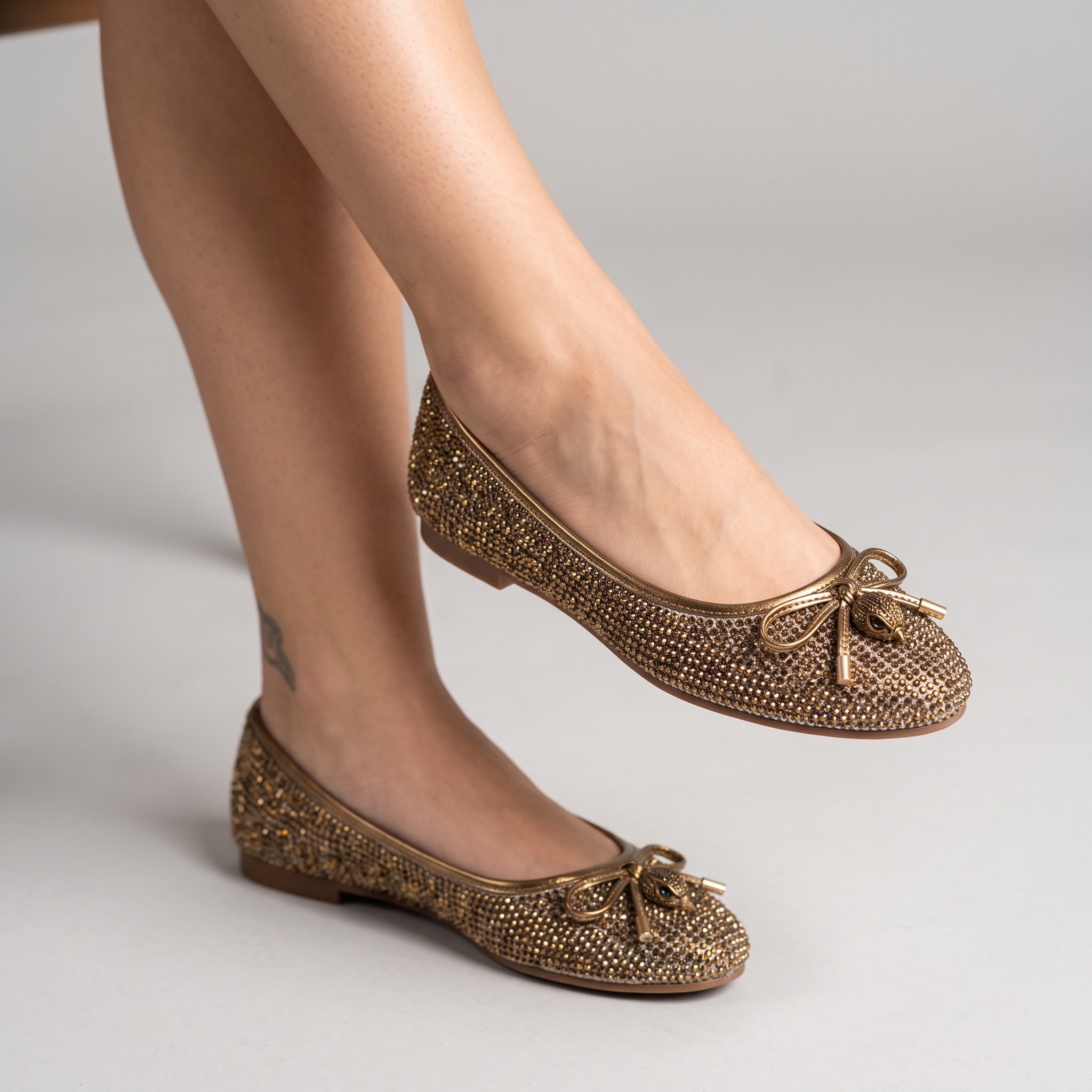metallic gold crystal embellished ballet flats with bow