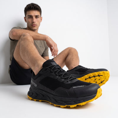 Columbia black trail sneaker with yellow lugged outsole and GORE-TEX branding