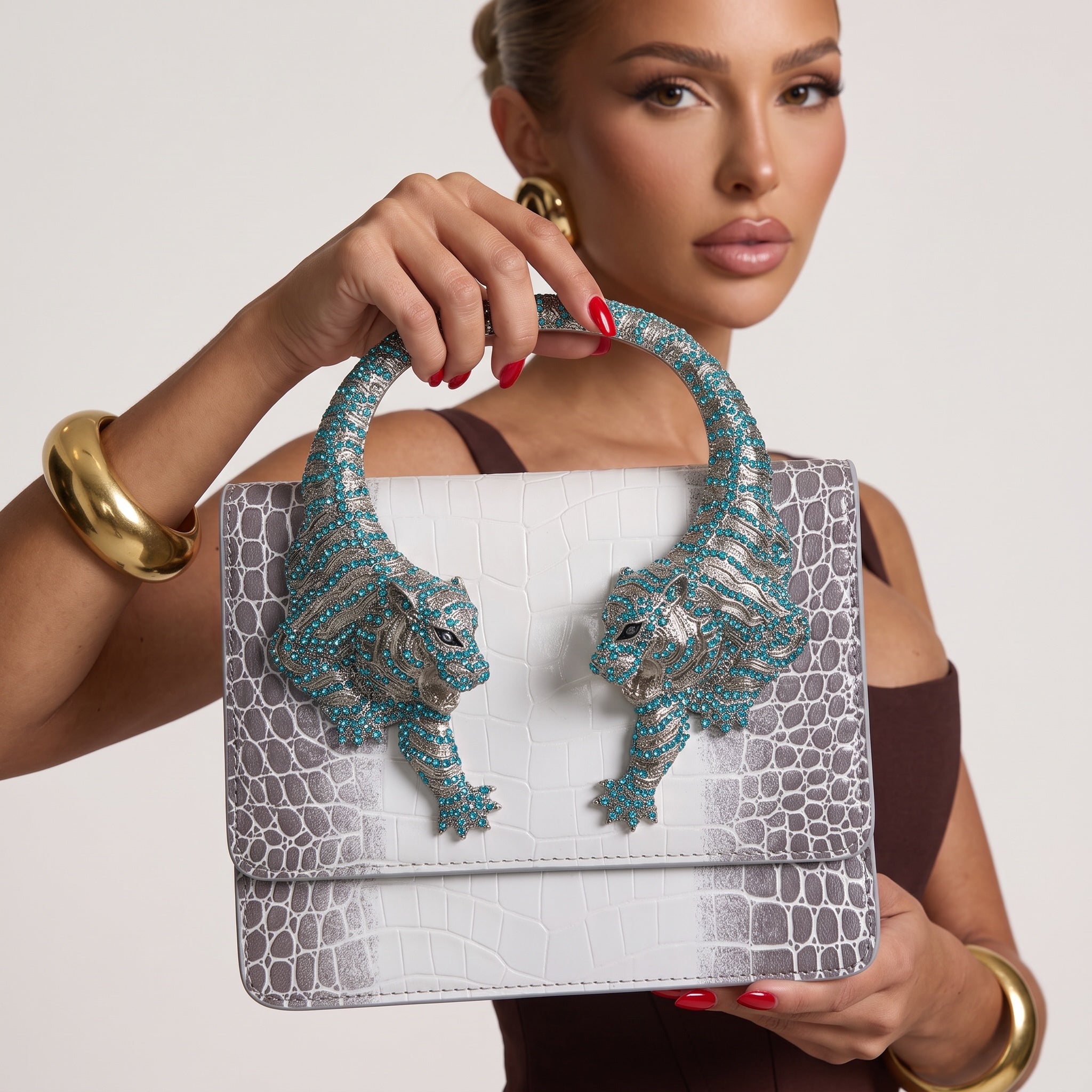 white and grey croc-print top-handle bag with turquoise crystal tiger-head hardware