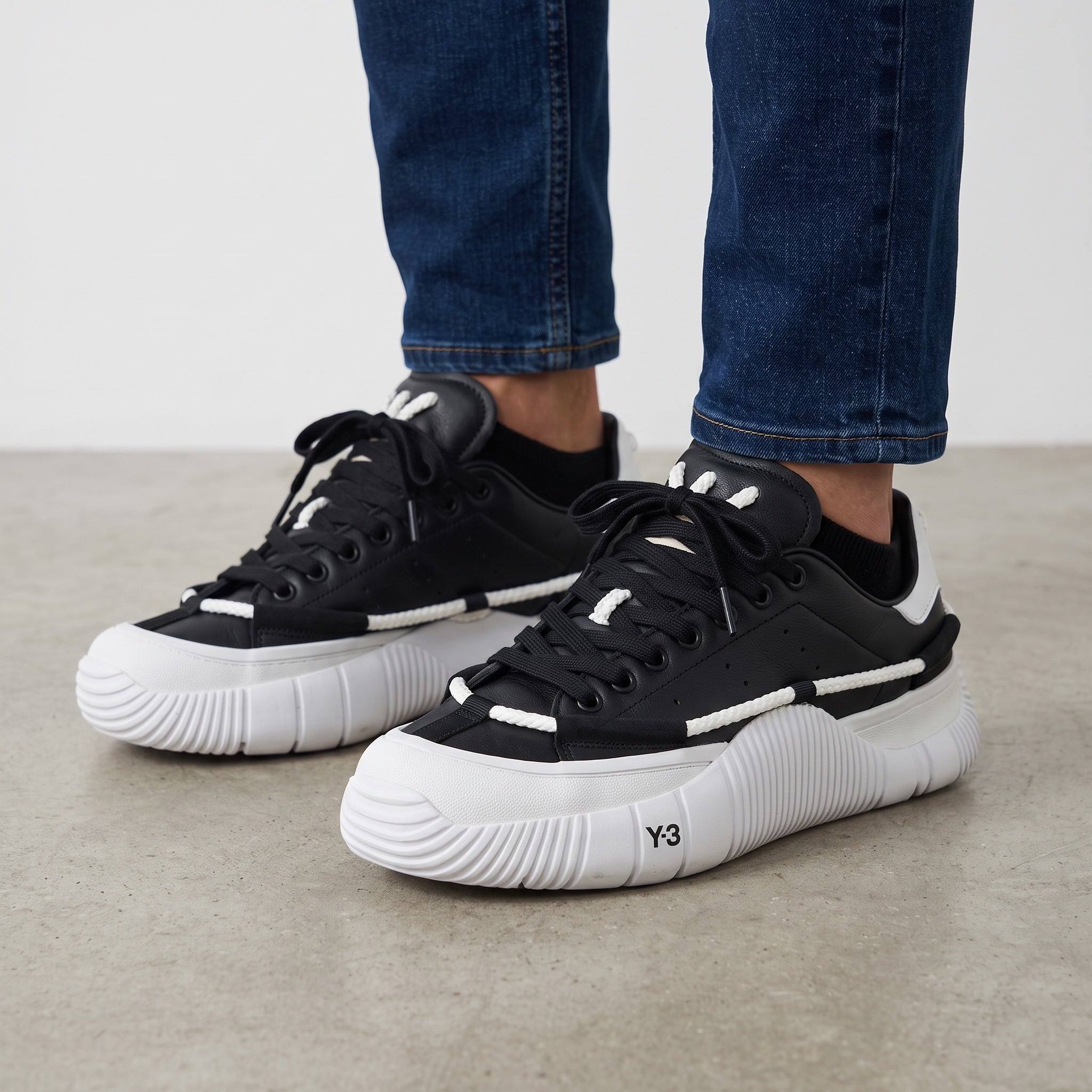 black and white Craig Green adidas low-top sneakers with rope detailing and ridged sole