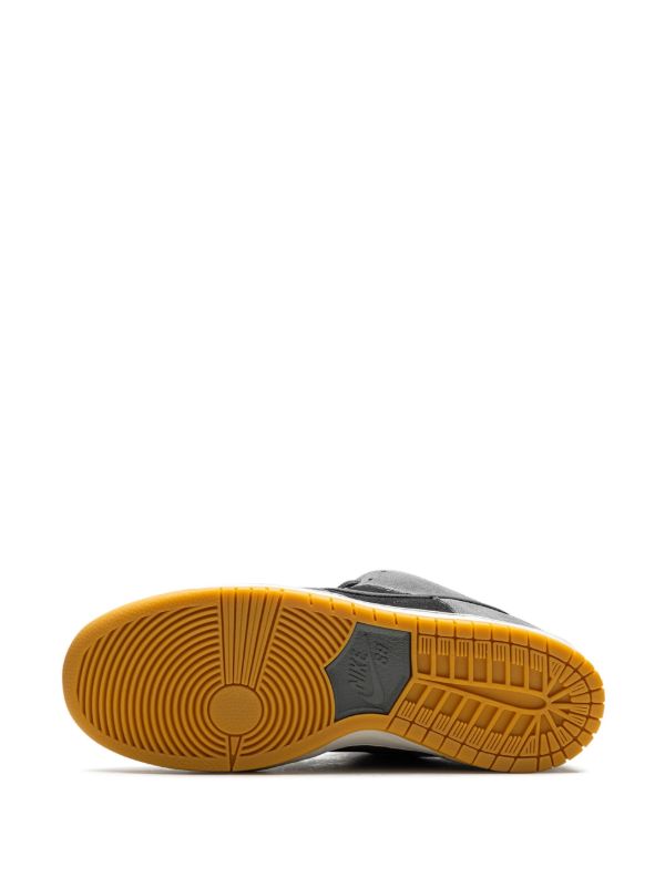 Nike Dunk Low grey and black sneaker with gum sole, side view