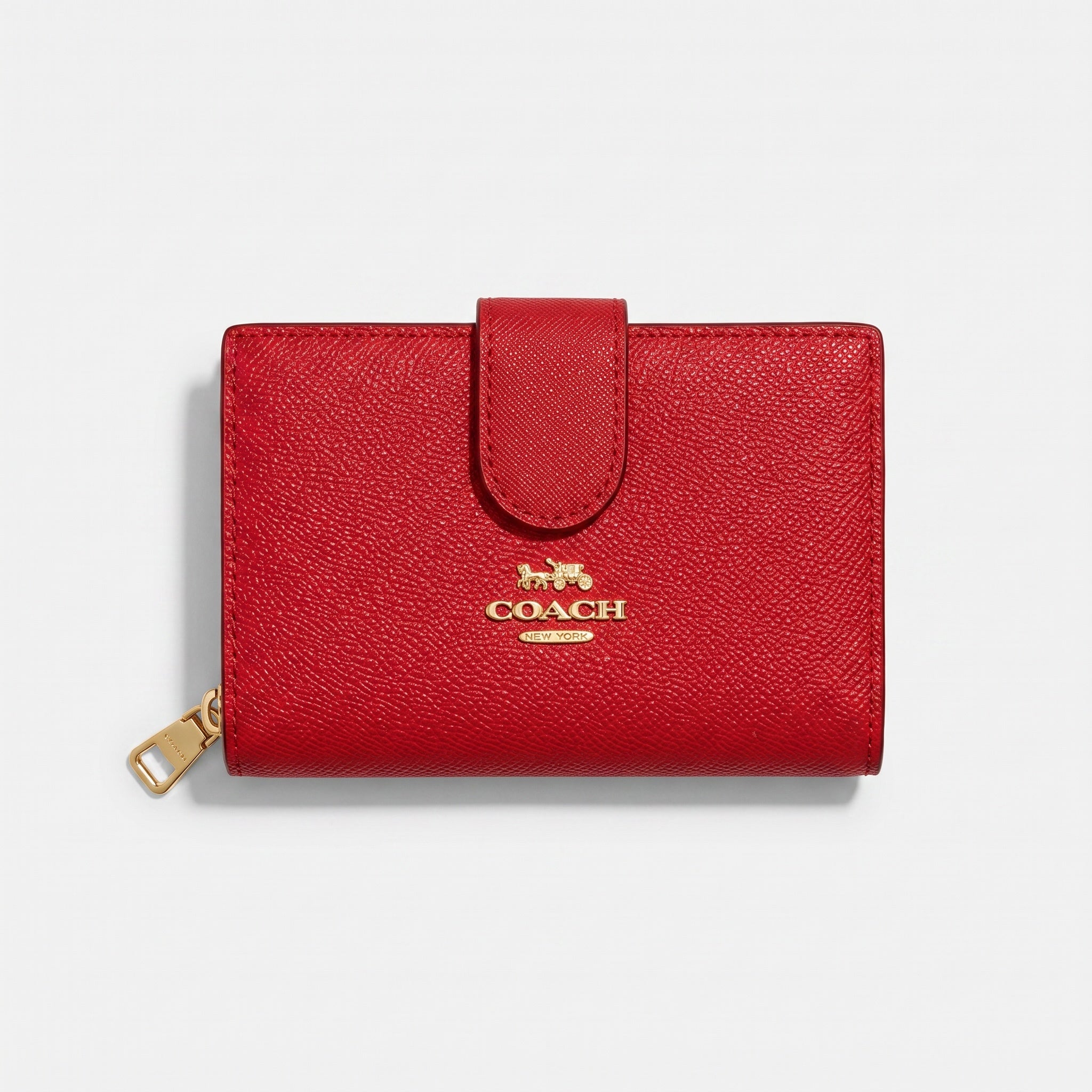 Coach small red tab wallet with gold logo and wristlet clip