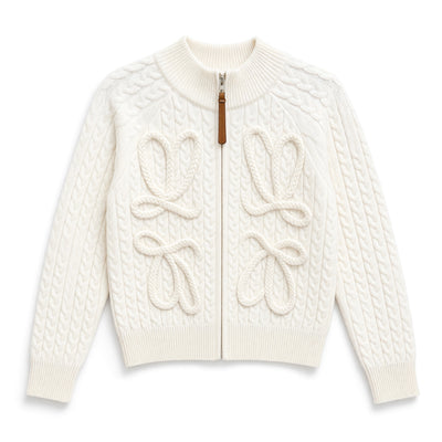 Ivory cable-knit zip jacket with rope bow details and leather zipper pull