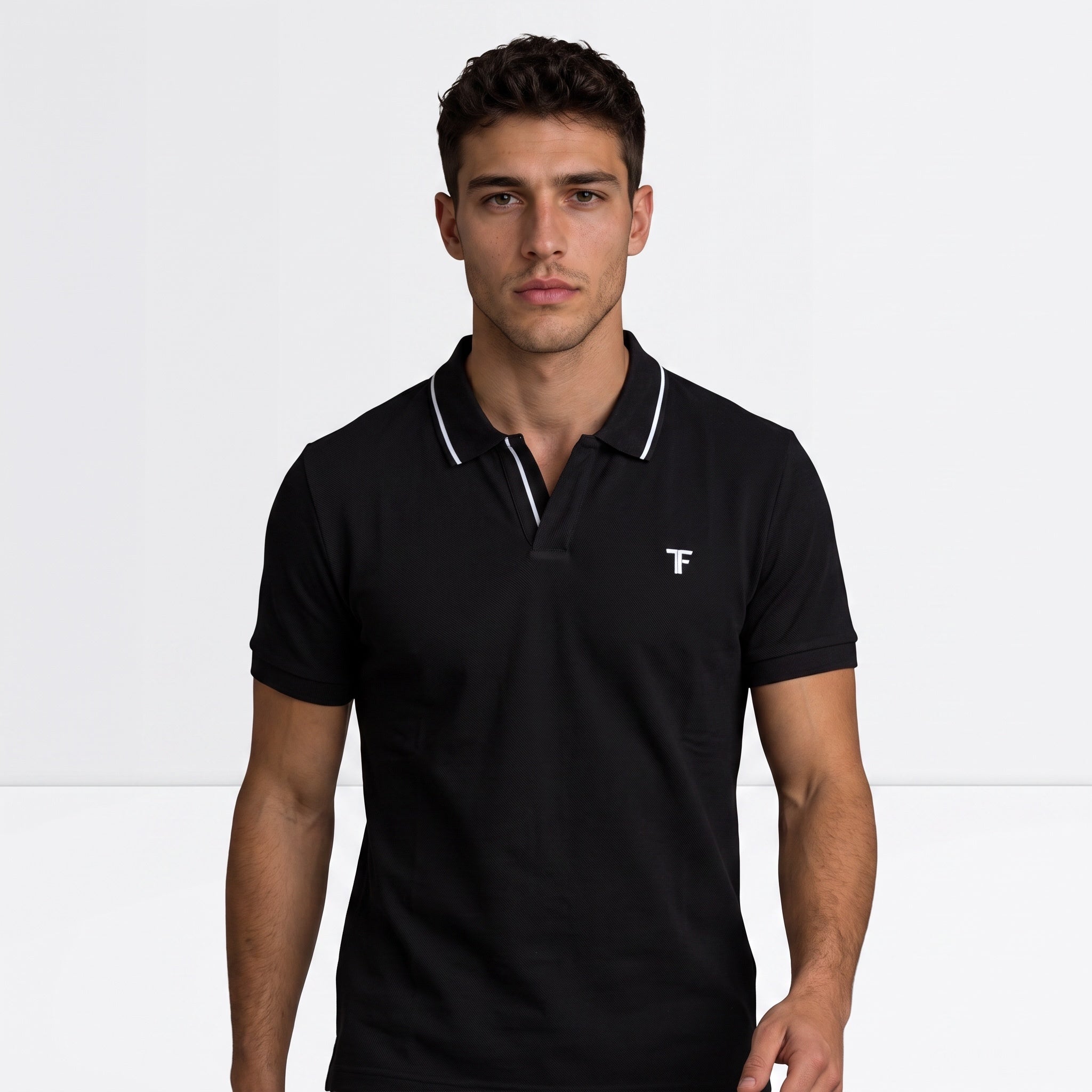 Black Tom Ford polo with white contrast piping and TF logo on chest