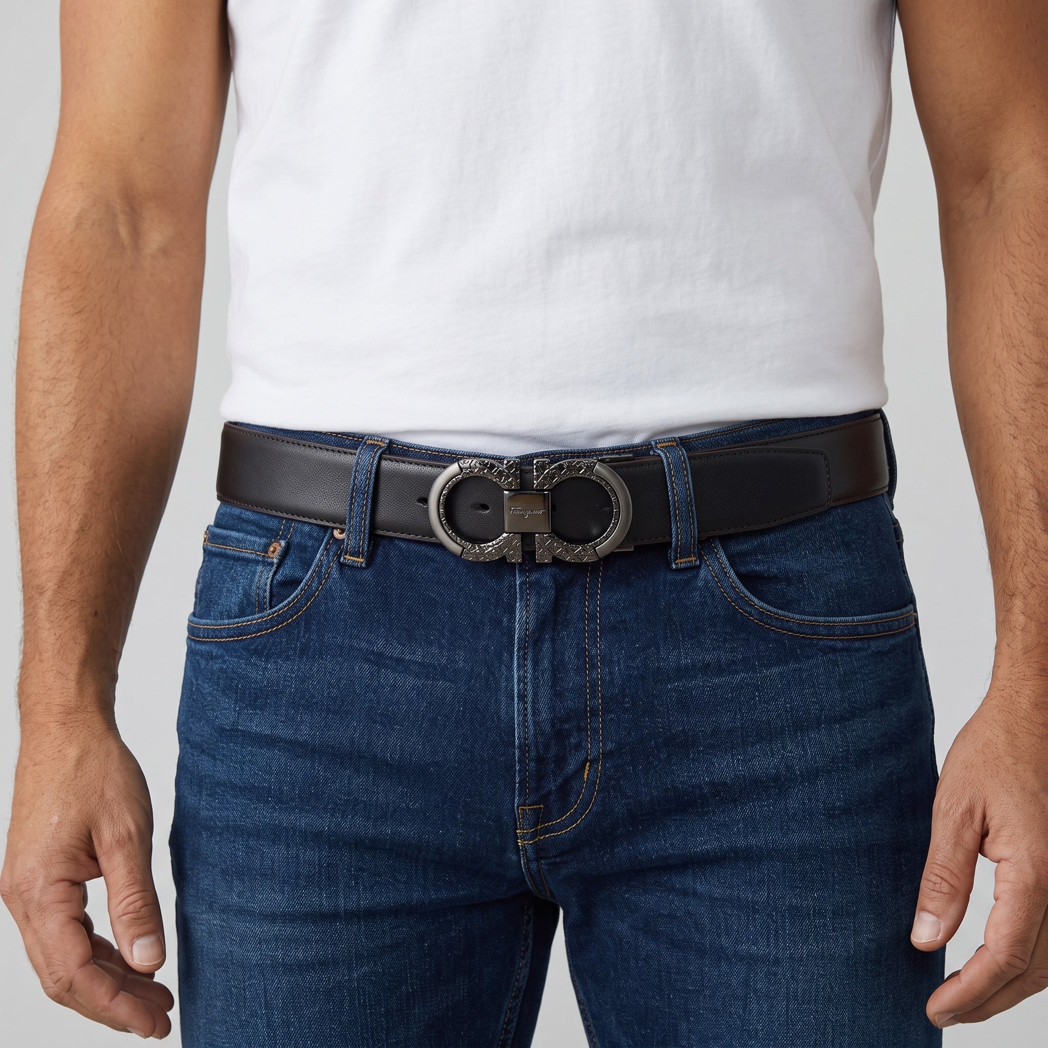 Black Ferragamo belt with double Gancini buckle worn with jeans