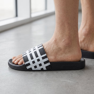 Burberry black and white check slide sandal on foot