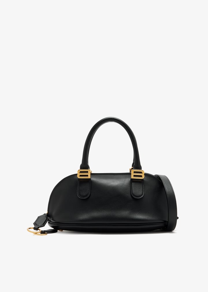 Black Balenciaga dome satchel with gold B hardware and top handles