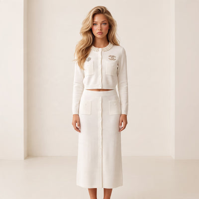 Cream cropped cardigan with pearl collar, chest pockets and decorative brooches