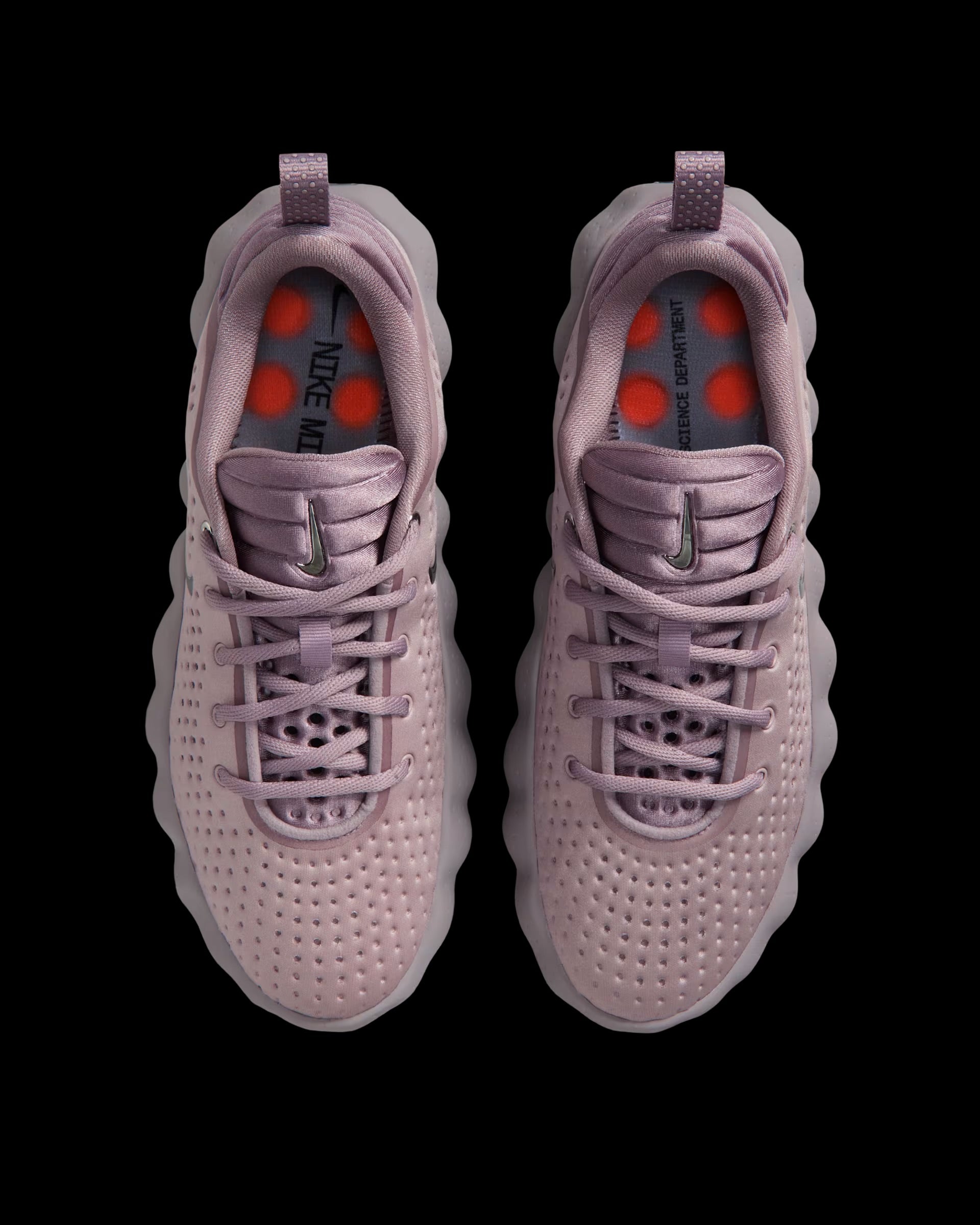 dusty pink nike sneaker with perforated upper and orange pod outsole