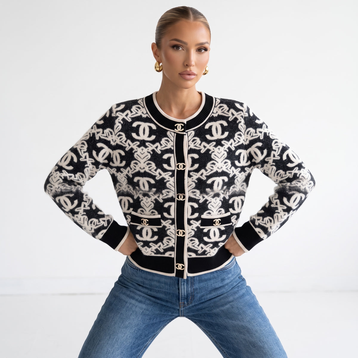Black and ivory Chanel knit cardigan with CC buttons and patch pockets