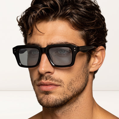 Close-up black square polarized sunglasses on male model