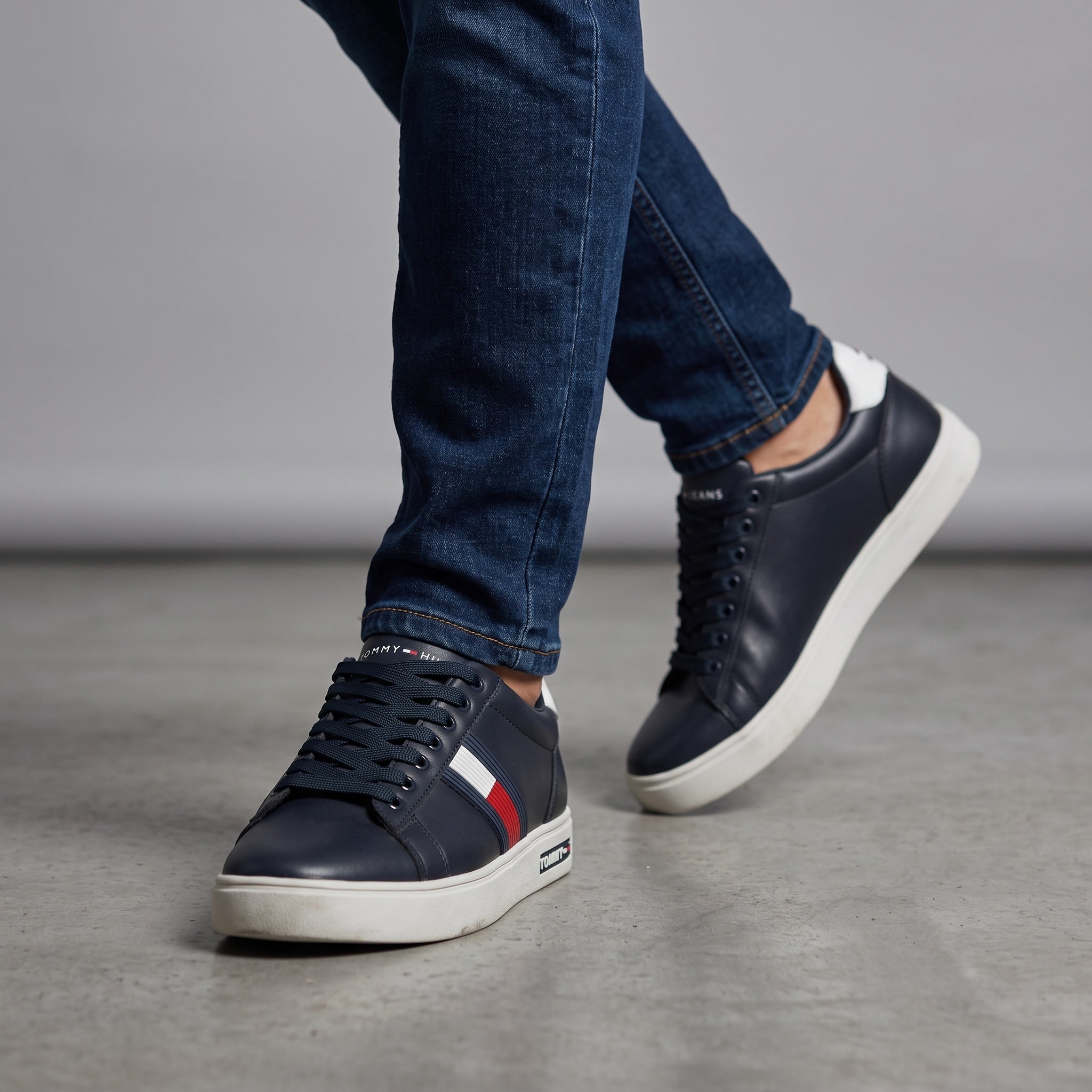 Tommy Hilfiger navy low-top sneakers with red white blue stripe and white sole