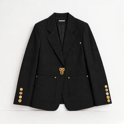 Black tailored blazer with gold clasp and gold sleeve buttons