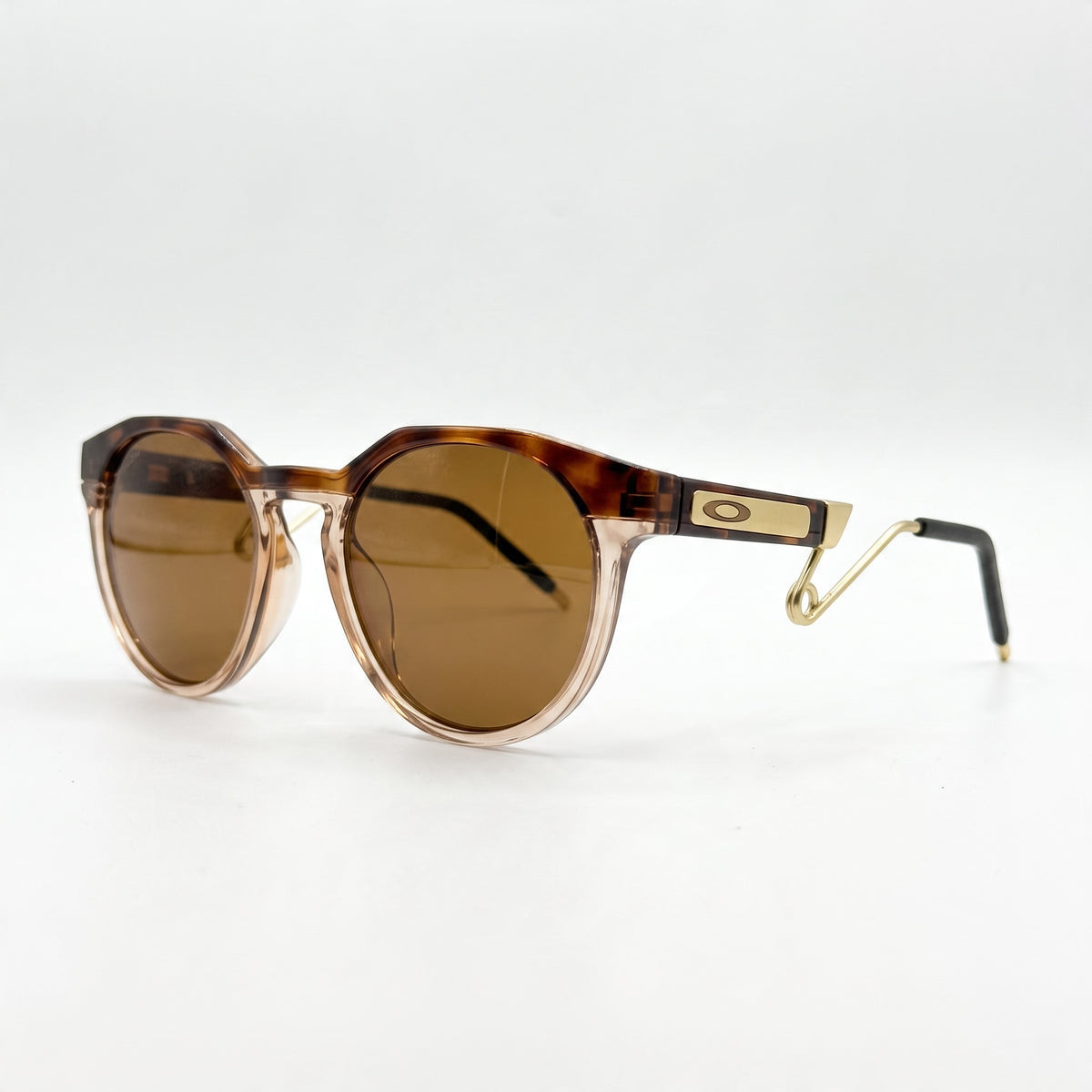 Oakley tortoise geometric sunglasses with brown lenses and gold temples