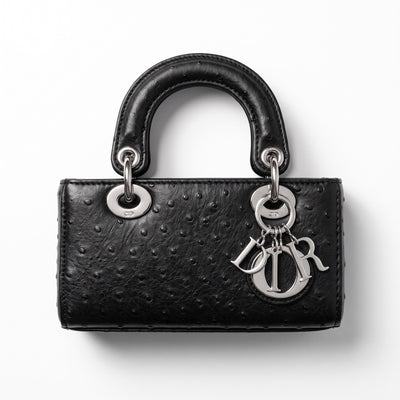 Black Dior Lady Dior top-handle bag with ostrich-effect texture and silver charms