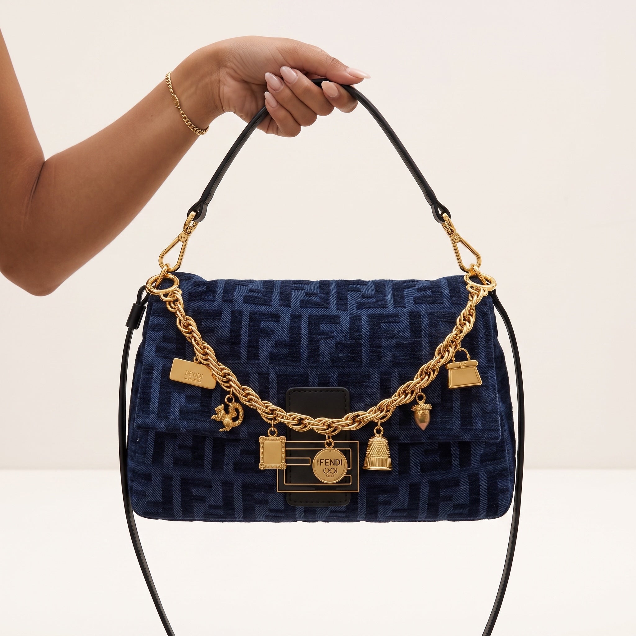 navy Fendi shoulder bag with gold charm chain and black strap