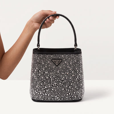 Prada black bucket bag covered in crystals with top handle and shoulder strap