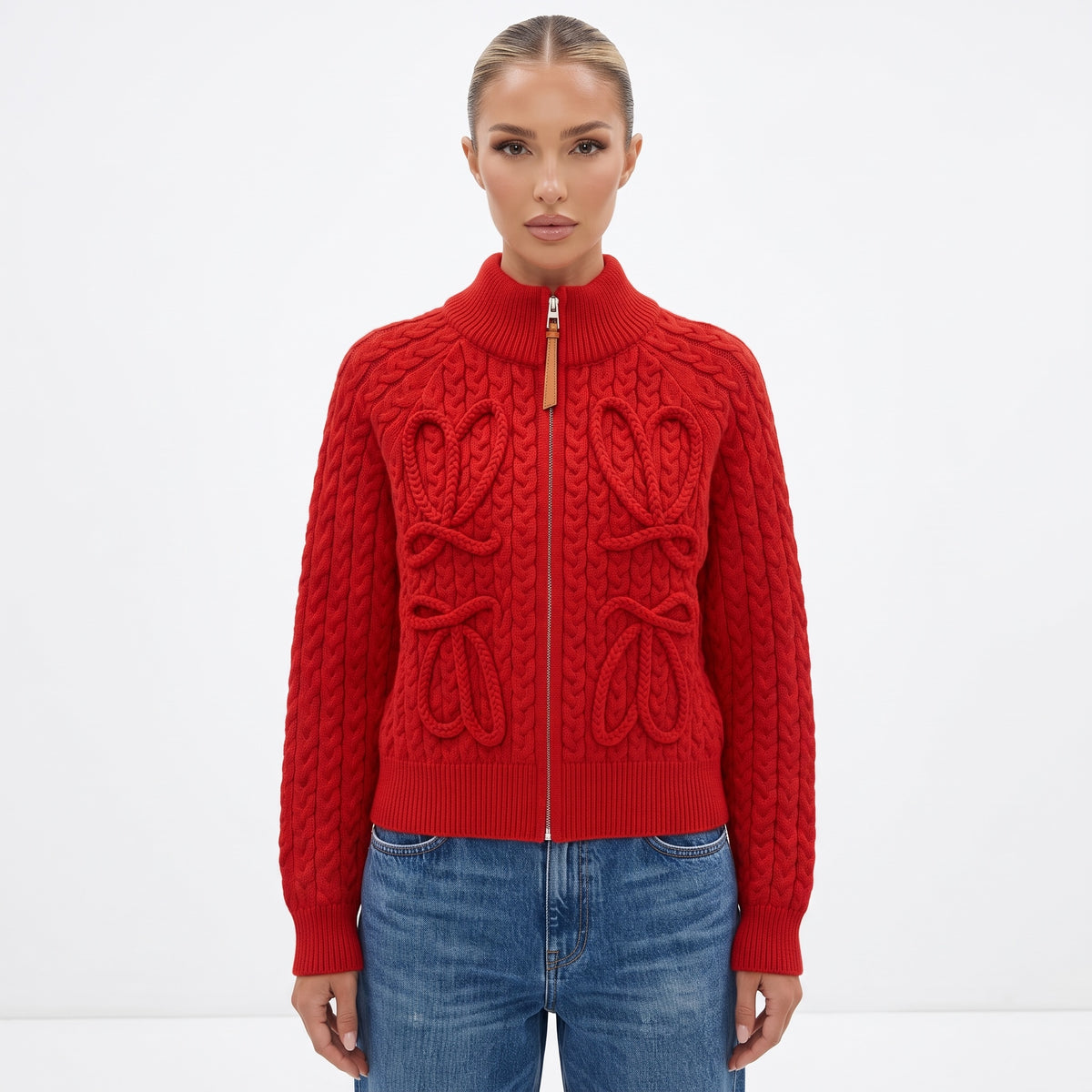 Red cable-knit zip cardigan with leather zipper pull and ribbed collar