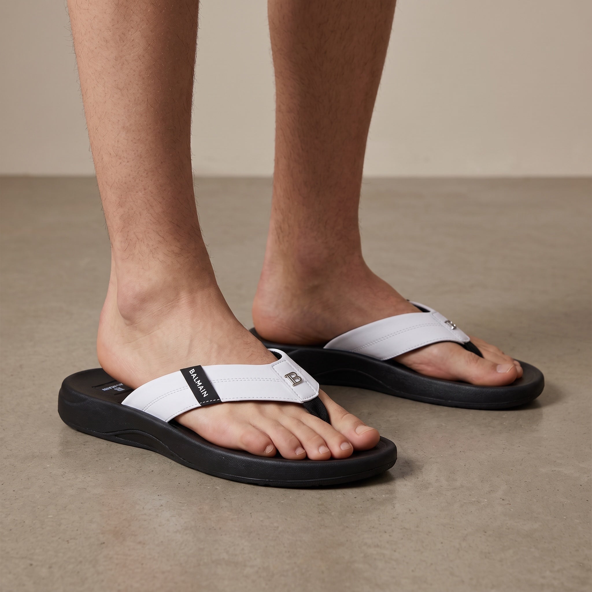 Balmain white strap flip-flops with black sole and Balmain logo on strap