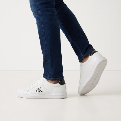 Calvin Klein white low-top sneakers with black heel tab and cK logo