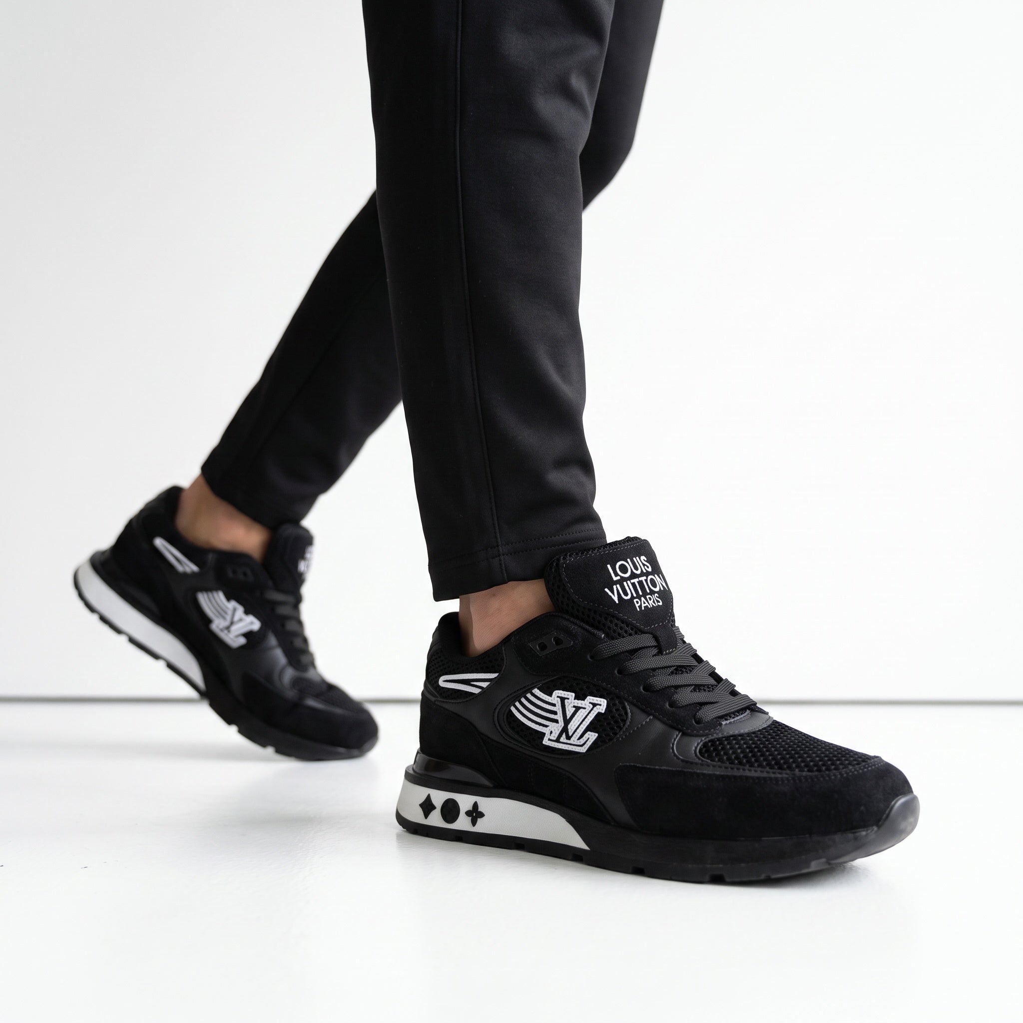 Black Louis Vuitton sneakers with LV wing logo and monogram midsole