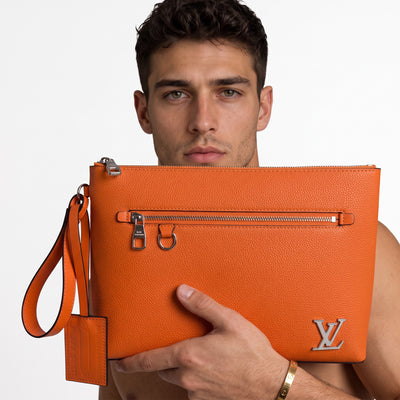 orange Louis Vuitton leather pouch with LV logo and front zip pocket