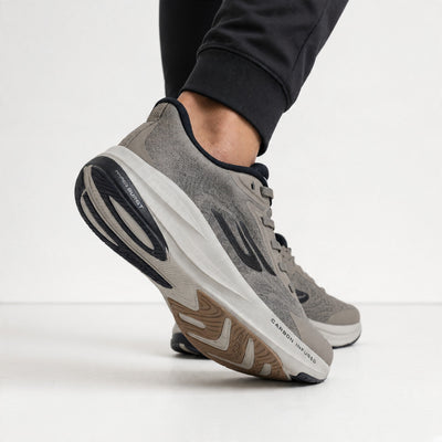 pair of grey Skechers trainers with carbon-infused midsole