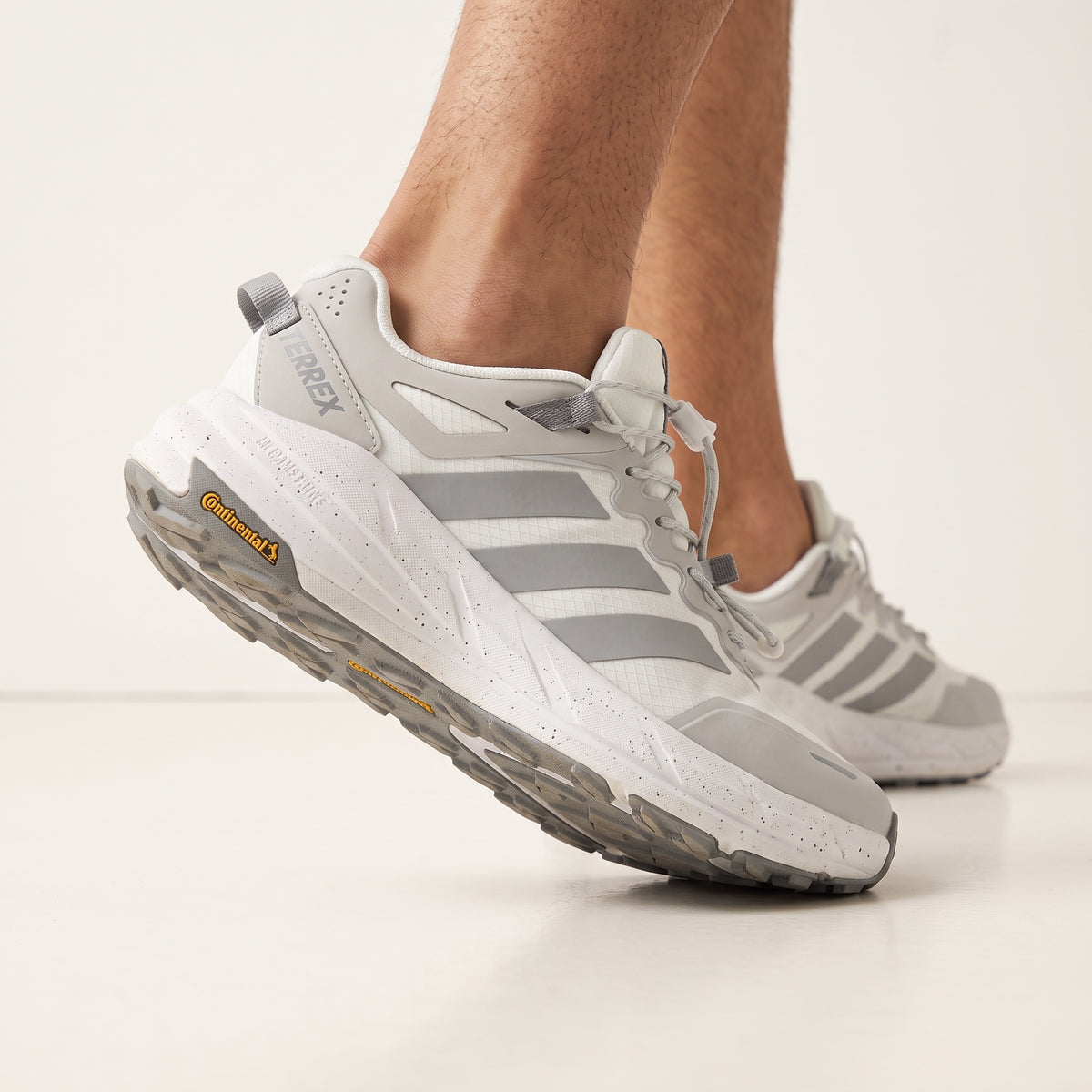 Adidas Terrex white and grey trail running sneaker with Continental outsole and toggle lacing