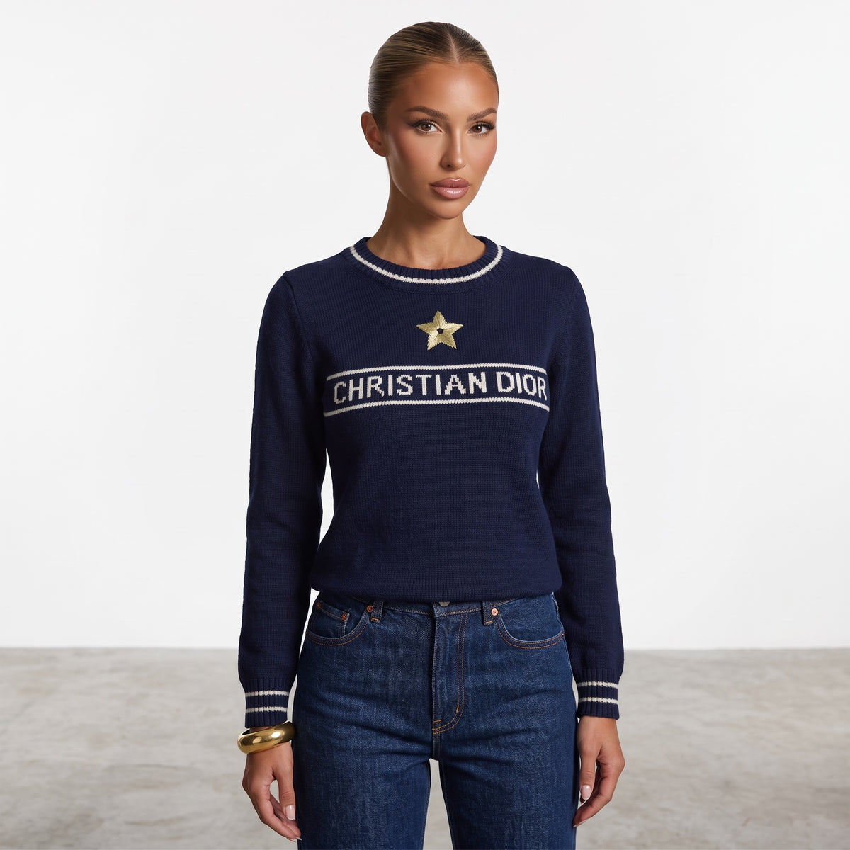 Christian Dior navy crew neck sweater with white logo band and gold star