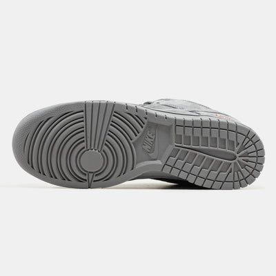 Grey Nike Dunk Low suede sneaker with small red Supreme box logo at heel
