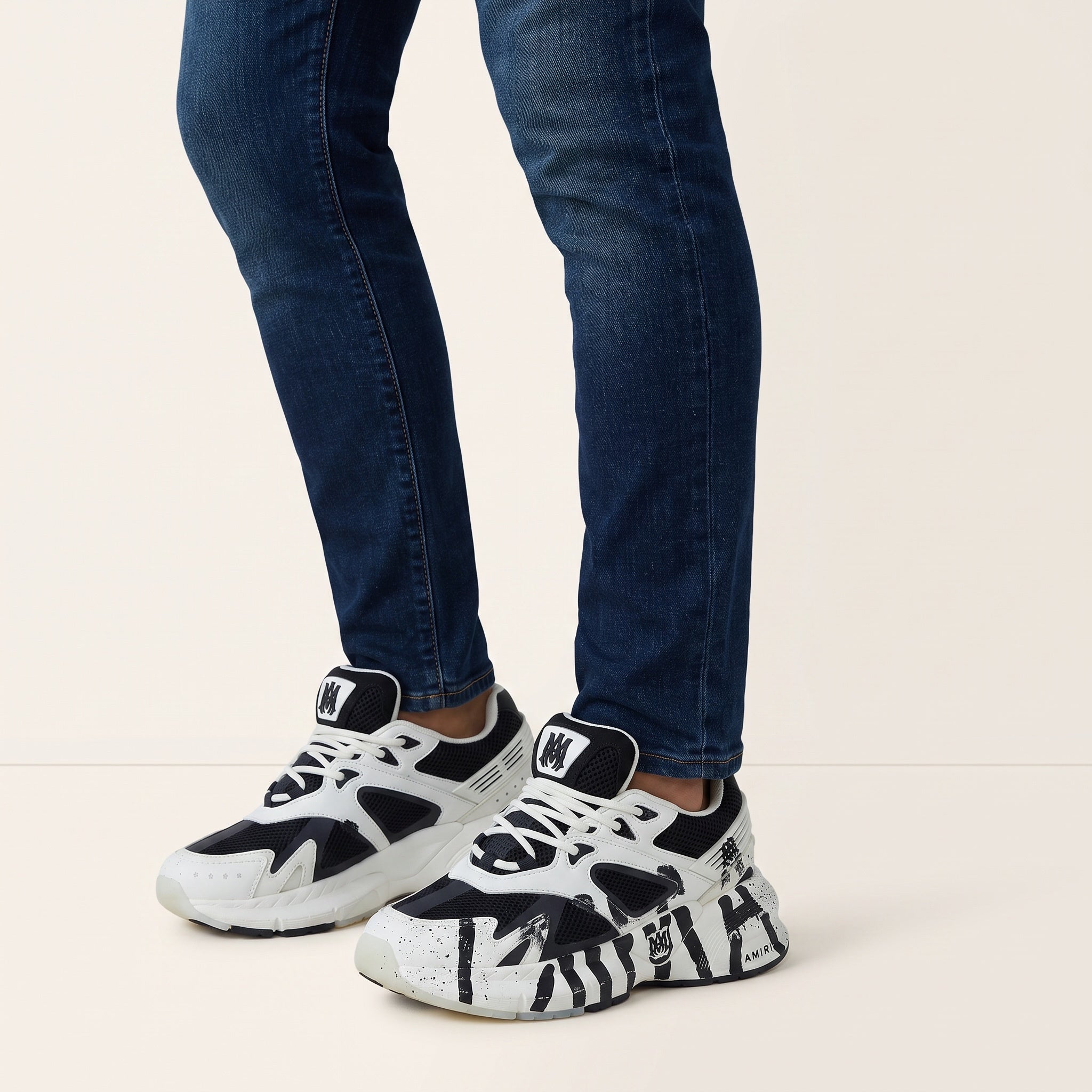 Amiri black and white chunky sneakers with paint‑stroke graphics