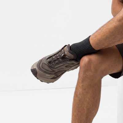 adidas brown trail sneaker with chunky lug sole and quick-lace toggle