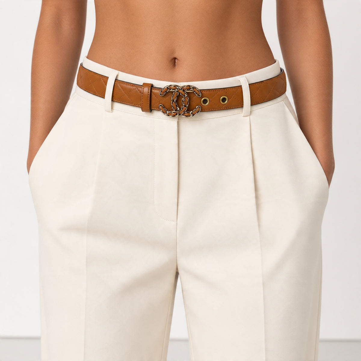 tan quilted belt with gold interlocking CC-style buckle