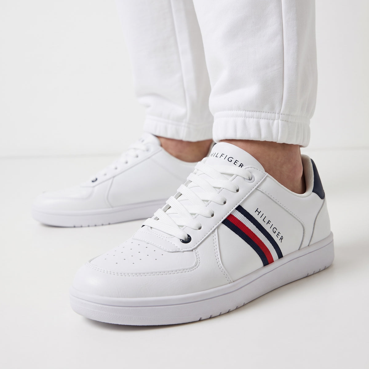 Tommy Hilfiger white low-top sneakers with navy heel tab and red-blue side stripes