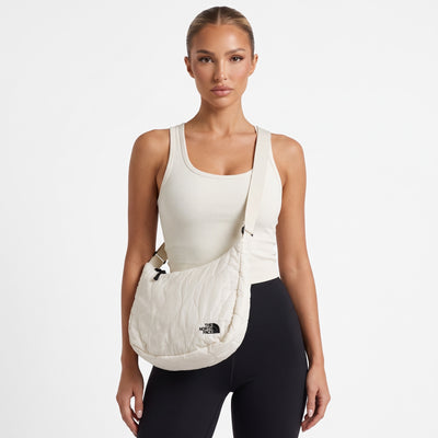 Ivory quilted The North Face crossbody bag with adjustable strap