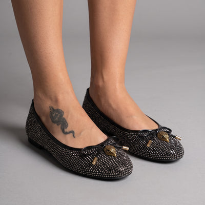 black crystal-embellished ballet flats with gold-tone charm at toe
