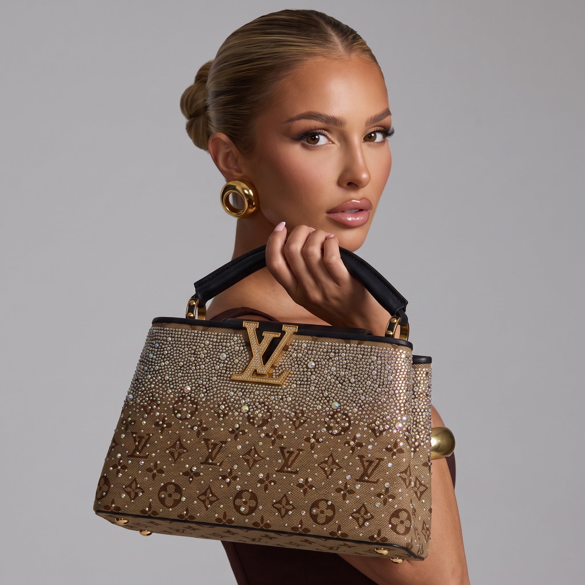 Louis Vuitton brown monogram top-handle bag covered in crystals with gold LV plaque