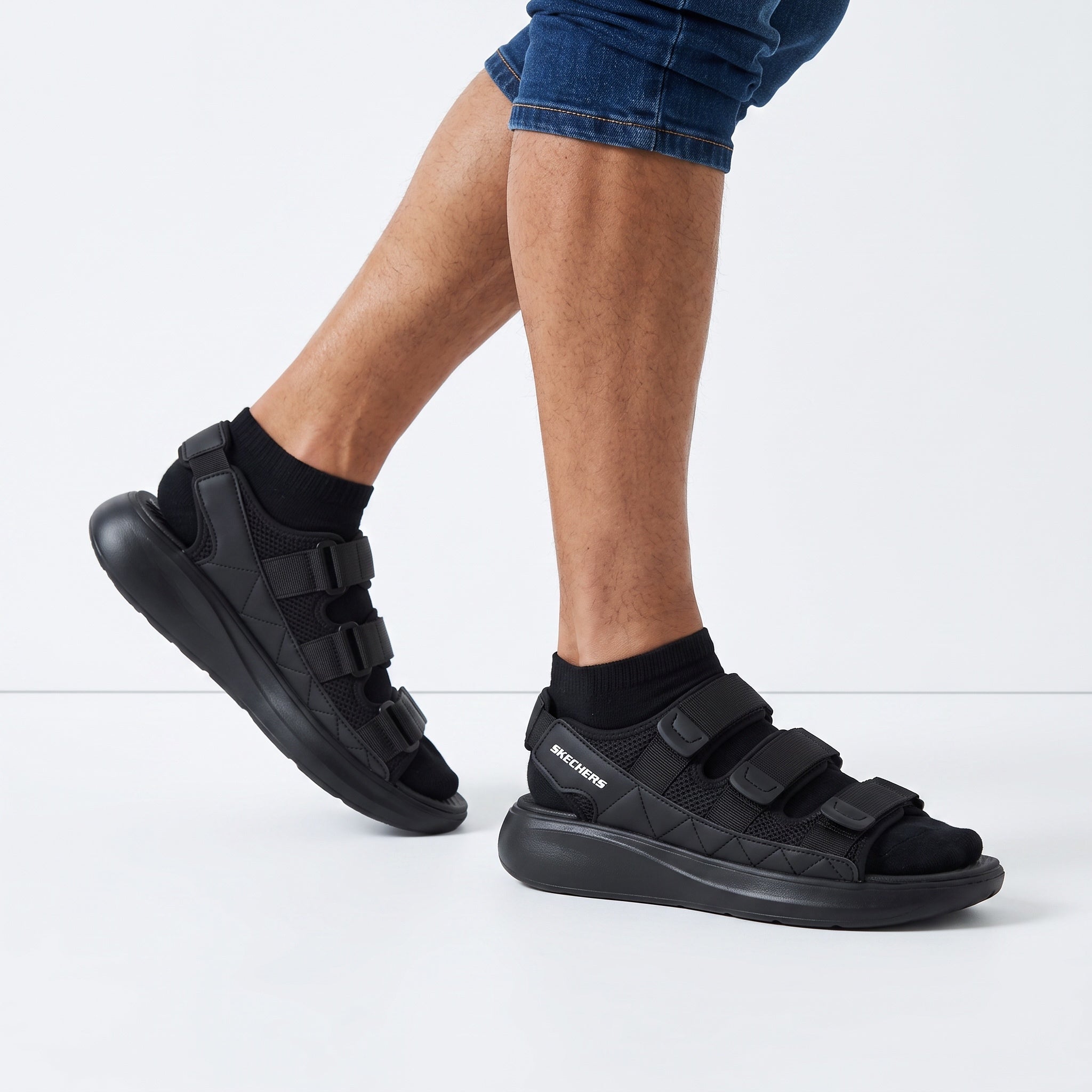 Black Skechers chunky platform sandals with three adjustable straps