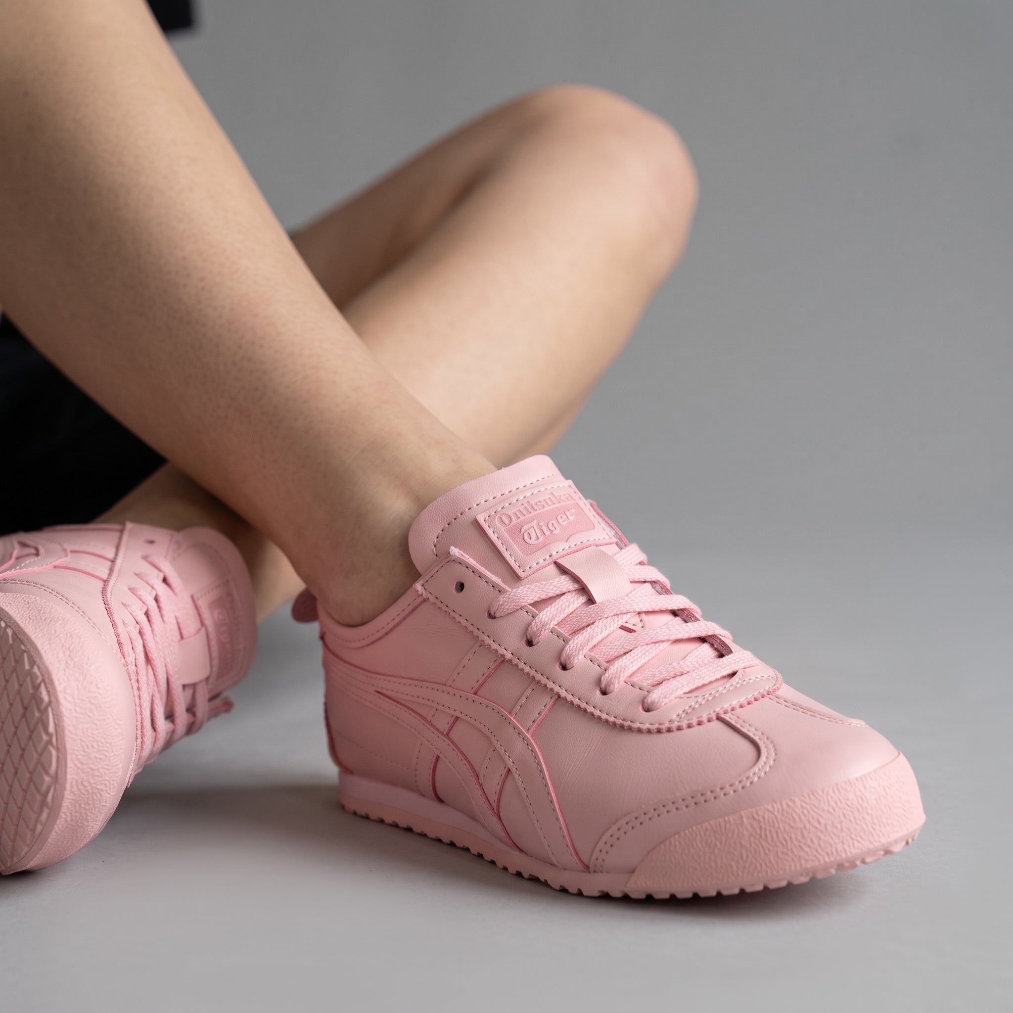 Onitsuka Tiger pastel pink low-top sneakers with tonal finish and textured sole