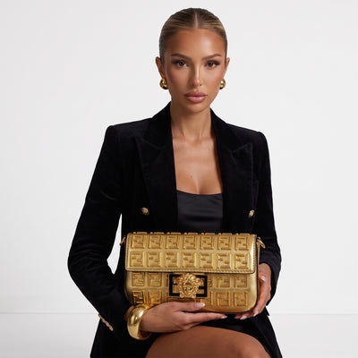 gold Fendi flap bag with embossed FF pattern and gold medallion clasp