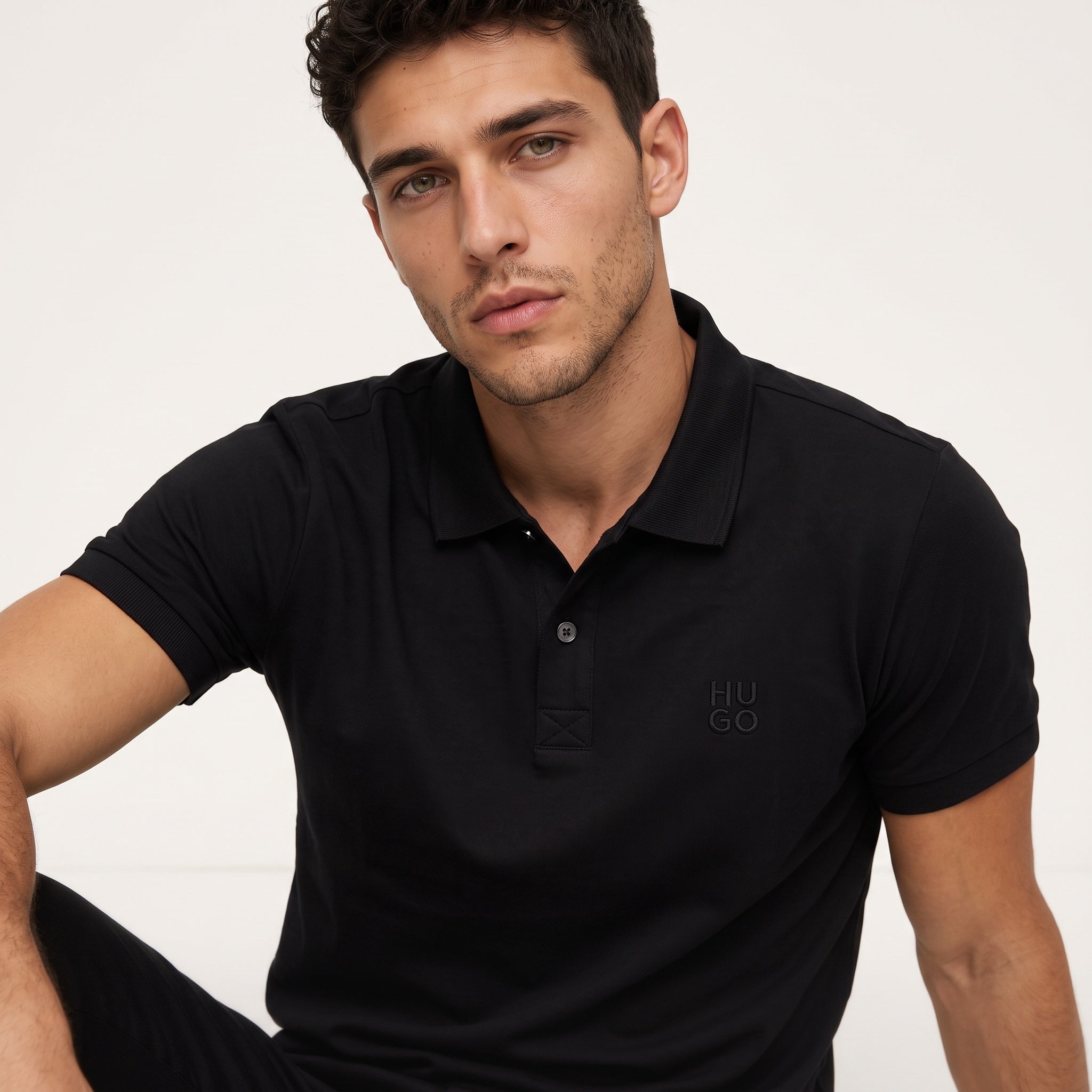 Men's black HUGO slim short-sleeve polo with tonal logo