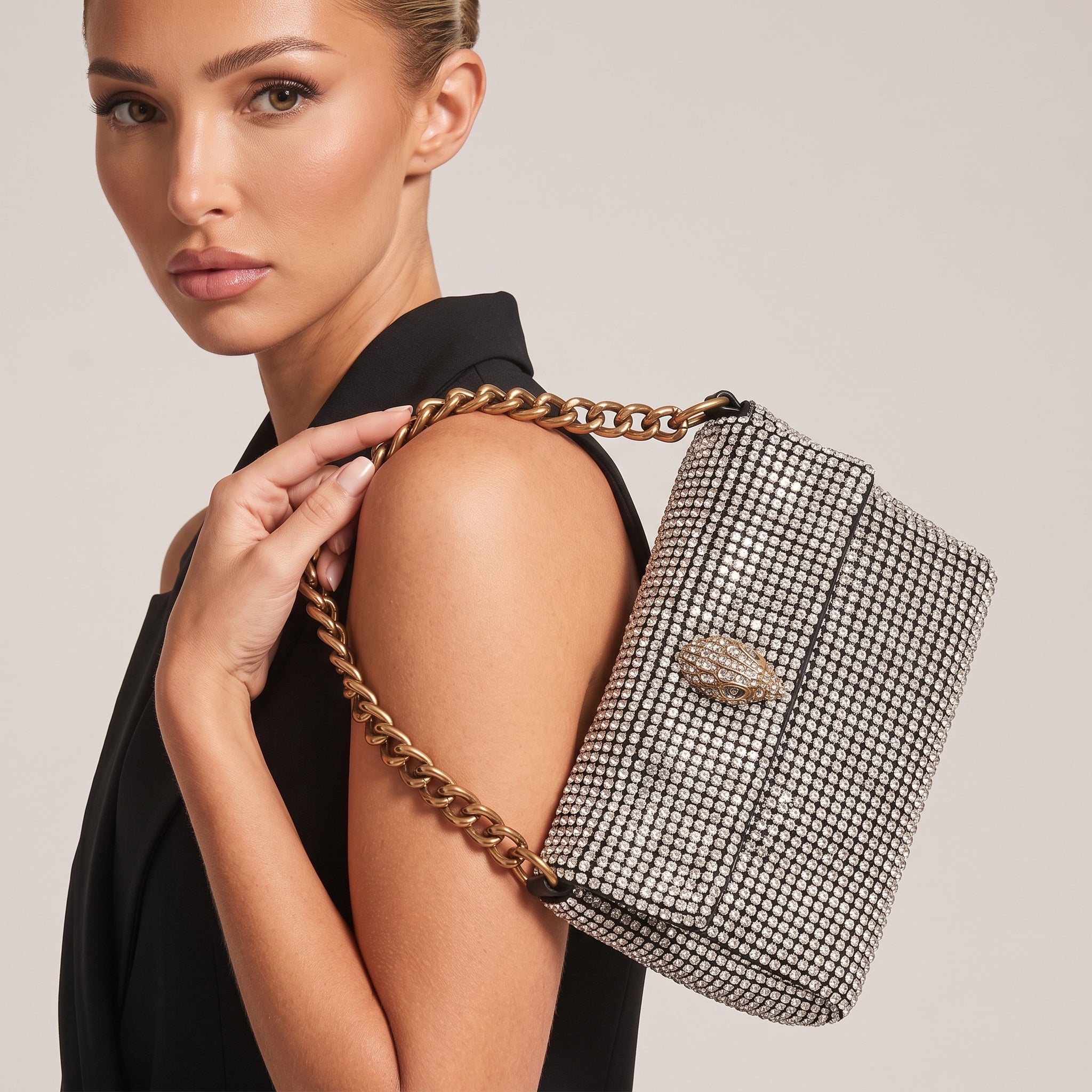 silver crystal shoulder bag with gold chunky chain and jeweled clasp