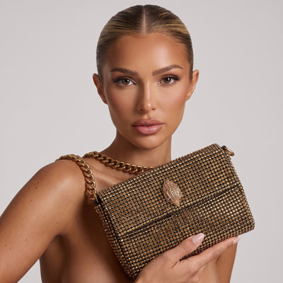 gold crystal mesh shoulder bag with sculpted jewel clasp and chunky chain strap
