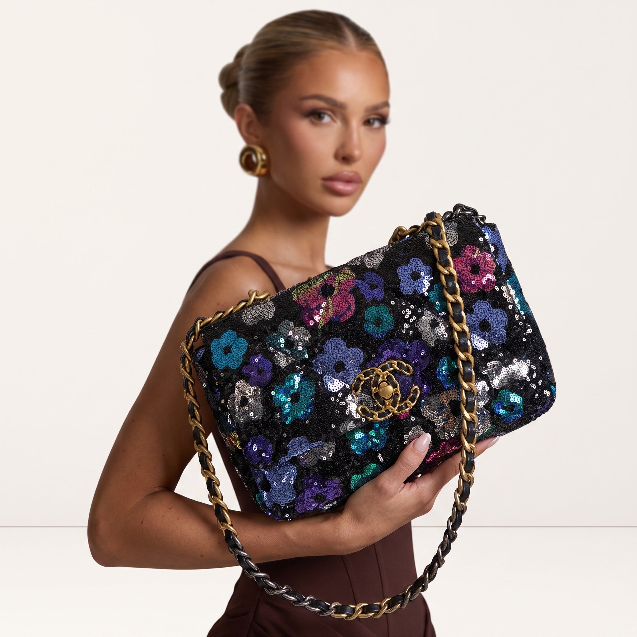 Chanel black sequin floral flap bag with gold CC logo and mixed-metal chain handle