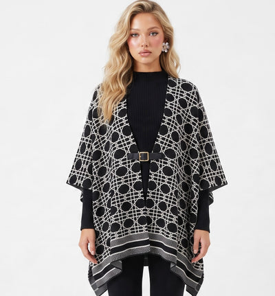 Black geometric patterned poncho with front buckle on model