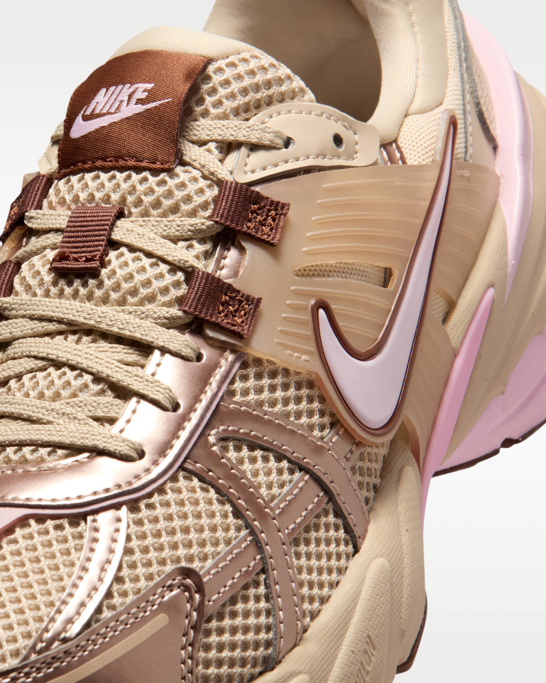 Nike tan and pink chunky sneaker with mesh upper and metallic overlays