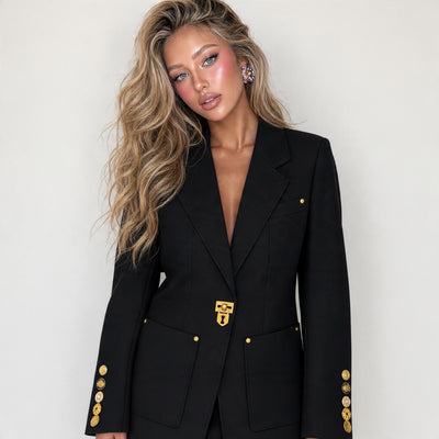 Black tailored blazer with gold clasp and gold sleeve buttons